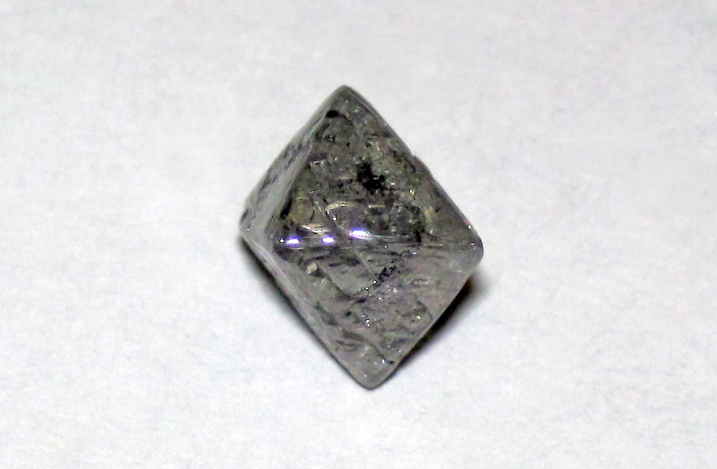 A rough octahedral diamond crystal